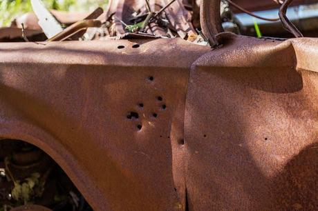 car body with bullet holes