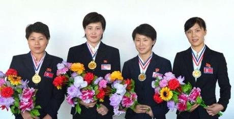 DPRK women boxers Ri Hwang Mi, Ri Kwang Suk, U Yong Gum and Kim Hwang Mi who participated in the 3rd Taipei City Cup invitational international boxing tournament held during 15-18 August 2013 (Photo: Rodong Sinmun).
