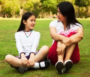 mom-talking-to-tween-daughter-in-park