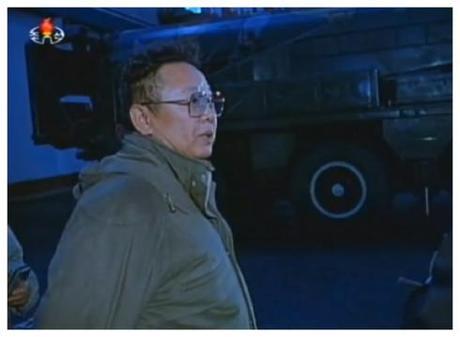 Late DPRK leader Kim Jong Il stands close to a TEL carrying a version of the Nodong medium-rang ballistic missile during a guidance visit that appears to be from the early 2000s.  The image is from a documentary film aired  by DPRK state media to mark the 53rd anniversary of Military-First (So'ngun) Revolutionary Leadership (Photo: KCTV screengrab).