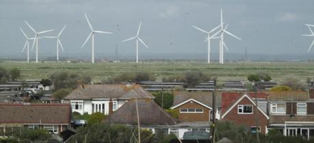 Houses located near a wind farm. (Credit: Flickr @ mat Walker http://www.flickr.com/photos/matski_98/)