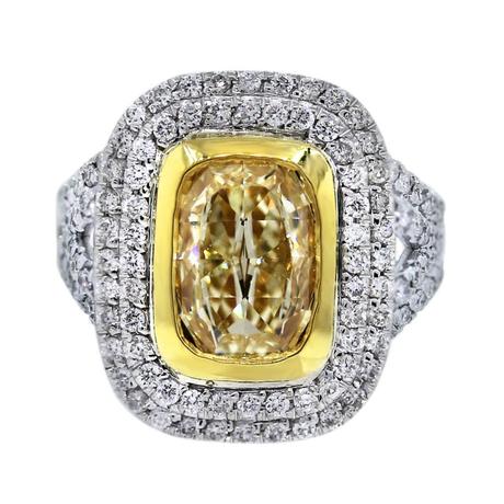 Fancy yellow oval diamond engagement ring