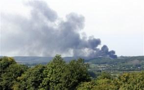  A fire at a police training area in Portishead, Bristol, sends out a giant plume of smoke. An anarchist group opposed to the badger cull has claimed responsibility for the fire which gutted a £16million police firing range Photo: SWNS.com