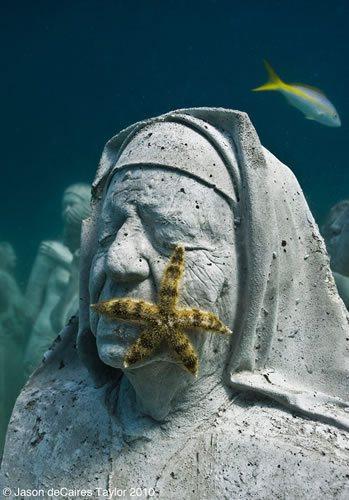 A starfish attracted to the beauty of this statue representing a nun