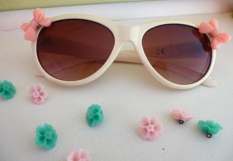 DIY fashion craft adding buttons and cabochon resin bows to sunglasses for summer 2013