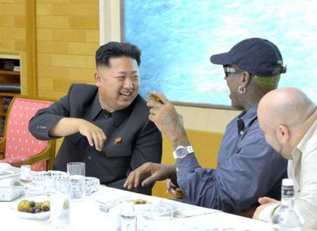Kim Jong Un (L) talks with Dennis Rodman at a dinner party held during Rodman's visit to the DPRK (Photo: Rodong Sinmun).