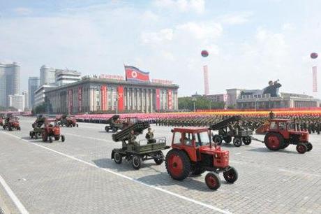 Red tractors tow multiple-launch rocket systems (MLRS) through Kim Il Sung Square on 9 September 2013 as part of the WPRK parade (Photo: Rodong Sinmun).