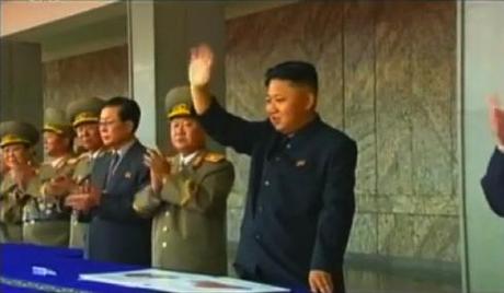Kim Jong Un waves to a parade and demonstration held to mark the 65th anniversary of the DPRK's foundation in Pyongyang on 9 September 2013.  Also seen in attendance are: VMar Kim Yong Chun, Gen. Jang Jong Nam, Gen. Ri Yong Gil, Jang Song Taek and VMar Choe Ryong Hae (Photo: KCTV still).