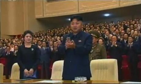 Kim Jong Un applauds after a performance by the Korean People's Internal Security Forces' Song and Dance Ensemble for the 65th anniversary of the DPRK's foundation, held at Ponghwa Art Theater in Pyongyang.  Also in attendance is his wife Ri Sol Ju (L) (Photo: KCTV screengrab).