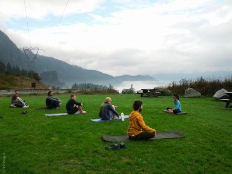 Marissa Land leading an impromptu yoga class after the showers stopped.