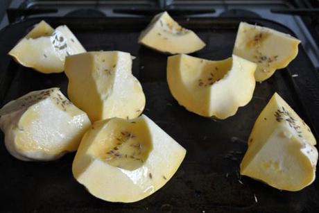 Sweet dumpling squash and cumin on roasting tray