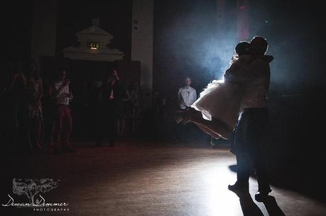Groom spins bride on dancefloor