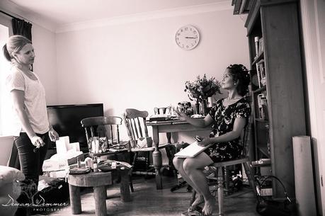 Bride inspects makeup at Home