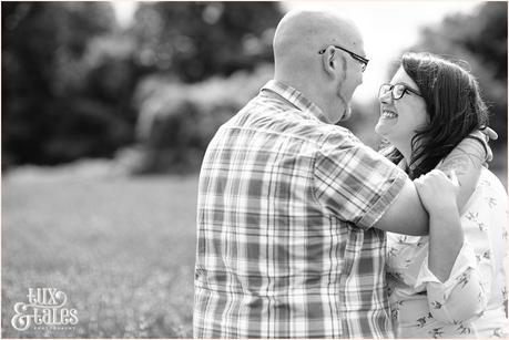 Alterntaitve couple has engagement shoot in UK lanvender field she is wearign thick black glasses