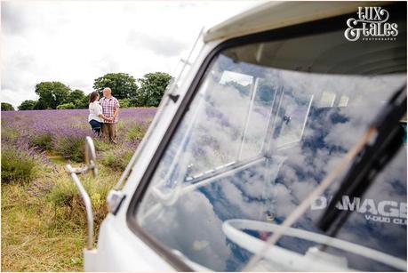 Rocker couple and refelctions of clouds as seen through the reflection on the screen of a vintage VW camper van 