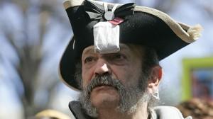 Tea Party member Greg Hernandez, of Quicksburg, Va., wearing a tri-corner hat and tea bag. (AP Photo/Steve Helber)