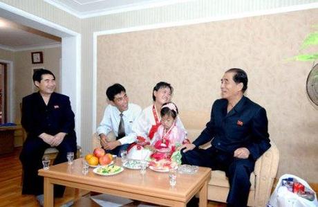 DPRK Premier Pak Pong Ju (R) visits a family at the U'nha Scientists' Street in Pyongyang on 18 September 2013 (Photo: Rodong Sinmun).