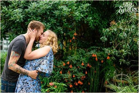 Portrait of coule kissing and leaning back in front fo a tree in Sheffiled