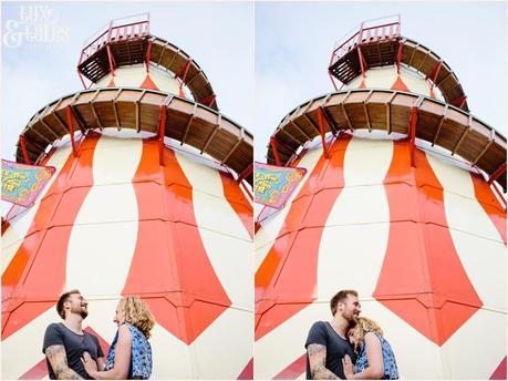 Engagement shoot pose in front of helter skelter in sheffiled city centre