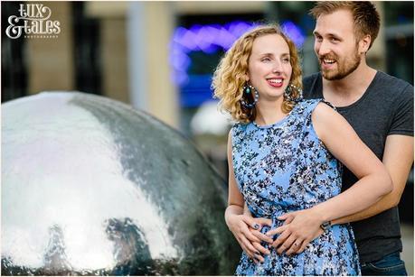 Portrait of Birde and groom in front of scheeidl waterfountain metal ball 