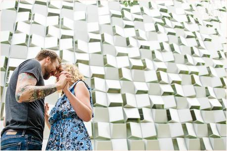 Couople kiss in front of Sheffiled building