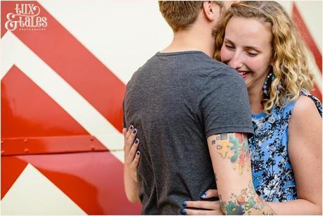 Engagement shoot pose in front of helter skelter in Sheffiled Yorkshire UK