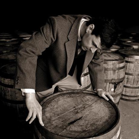 04 Dr Bill Lumsden, Director of Whisky Creation at Glenmorangie, inspecting a cask