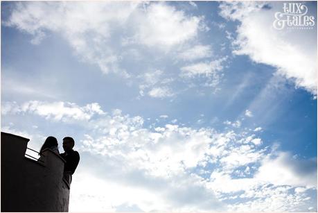 Silhouette of a couple on a tower at stockeld Park 