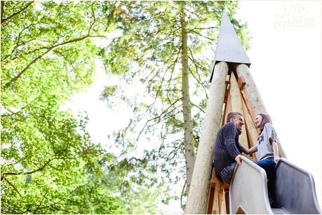 Engagement shoot on top of slide at Stockeld Park 