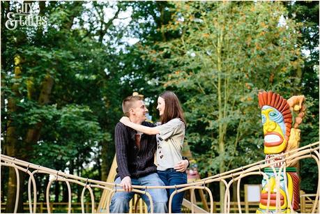 Engagemed couple embrace on rope bridge in Stockeld Park Yorkshire 