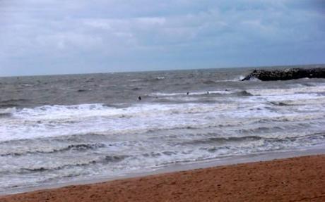 Surfers braving the cold waters of the North Sea