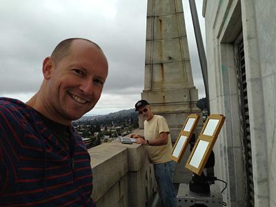 Solar Reflectors Installed Atop the Campanile Greg Dalton and John Vallerga install the heliostats on the roof of the Campanile. (Photo: Robert Lettieri)
