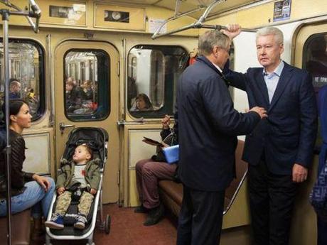 (Moscow Mayor Sergei Sobyanin, standing to the right next to the door.)