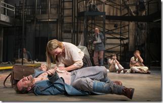 Beatriz (ensemble member Joan Allen, center) attempts to remove a bullet from a soldier (ensemble member Tim Hopper) in Steppenwolf Theatre Company’s American-premiere production of The Wheel by Zinnie Harris, directed by ensemble member Tina Landau.  (photo credit: Michael Brosilow)