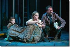 (right to left) Rossignol (Mark L. Montgomery) shares his apricots with Beatriz (ensemble member Joan Allen) and The Girl (Emma Gordon) in Steppenwolf Theatre Company’s American-premiere production of The Wheel by Zinnie Harris, directed by ensemble member Tina Landau.  (photo credit: Michael Brosilow)