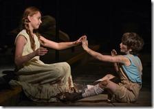 The Girl (Emma Gordon) and The Boy (Daniel Pass) play a game of pattycake in Steppenwolf Theatre Company’s American-premiere production of The Wheel by Zinnie Harris, directed by ensemble member Tina Landau. (photo credit: Michael Brosilow)