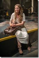 Beatriz (ensemble member Joan Allen) pauses for a moment on her journey, caring for an infant in Steppenwolf Theatre Company’s American-premiere production of The Wheel by Zinnie Harris, directed by ensemble member Tina Landau.  (photo credit: Michael Brosilow)