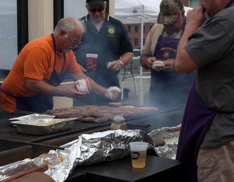 photo of men grilling pork burgers