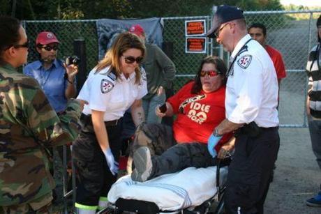 Lorraine Clair receives medical attention after being struck by RCMP cruiser. Photo: Miles Howe