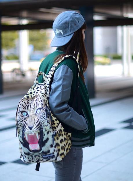 leopard print animal backpack breaking rocks look