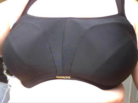 Front view of woman in black sports bra. 