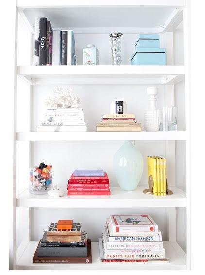 Organizing Your Library- Strike a balance between adding decorative touches and just cluttering your bookshelves- image via The Coveteur