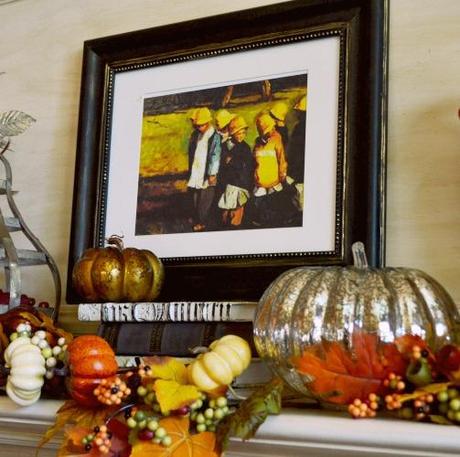 a centerpiece of the fall mantle, a pianting of children going back to school