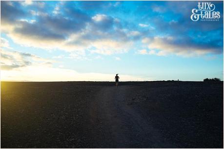 woman runner at sunrise in Lanzarote silhouette