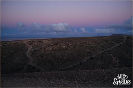 pink sunrise over volancic dunes in Lanzarote