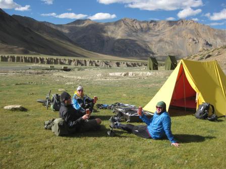 More rewards - superb campsites with beers included - Paul, Graham and Cliff soaking up more than just the landscape!