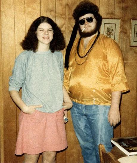 Young woman and man in sixties costumes.