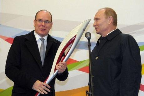 Mr. Putin presented one of the Olympic torches to Prince Albert II of Monaco.