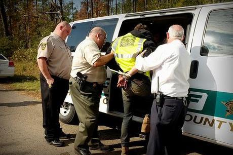 photo by Tar Sands Blockade, on Flickr / Blockader being arrested