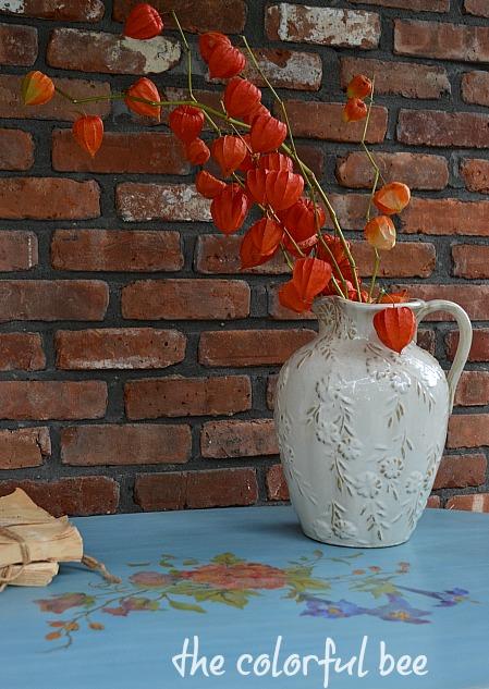 Chinese plantern plants on a blue chalk paint table